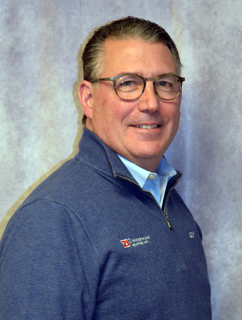 Professional headshot of Gerard “Gerry” Christian, CEO and President of Zimmerman Industries, Inc. - the inventor of the original volumetric concrete mixer, made in the USA.