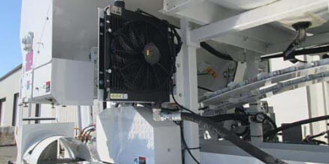 Hydraulic Fan Cooler in place to keep hydraulic oil cool on volumetric concrete mixing truck. To be added to mixing truck during times of continuous pouring.