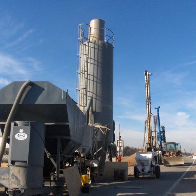 Low profile silo in transit to job site for on-site loading.