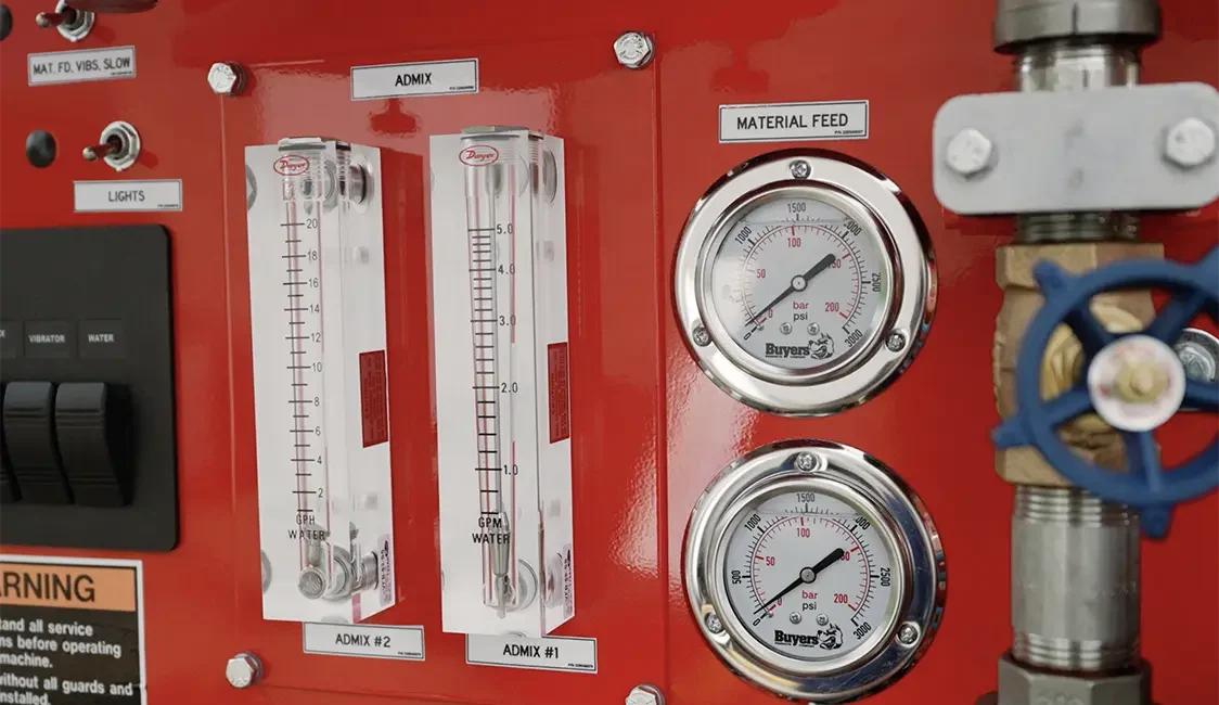 close-up view of zim-mixer control panel. material feed and admix in view.